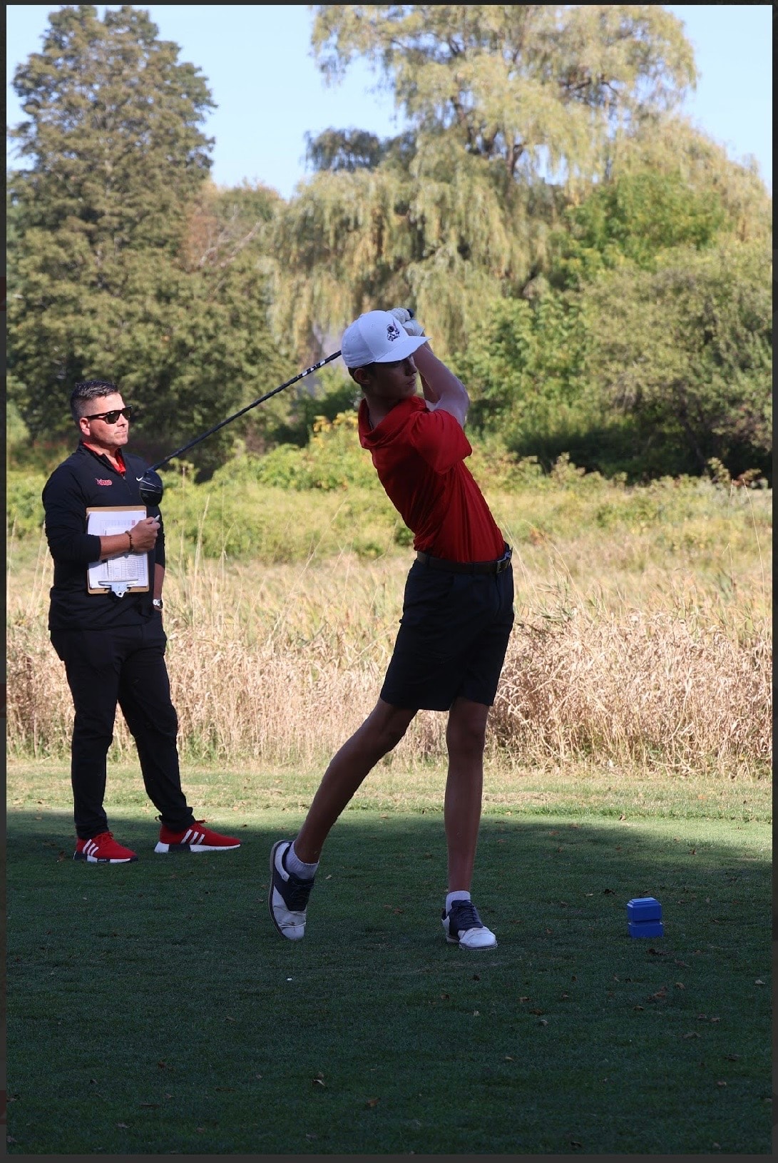 Luke Lojko mid-swing at a tournament